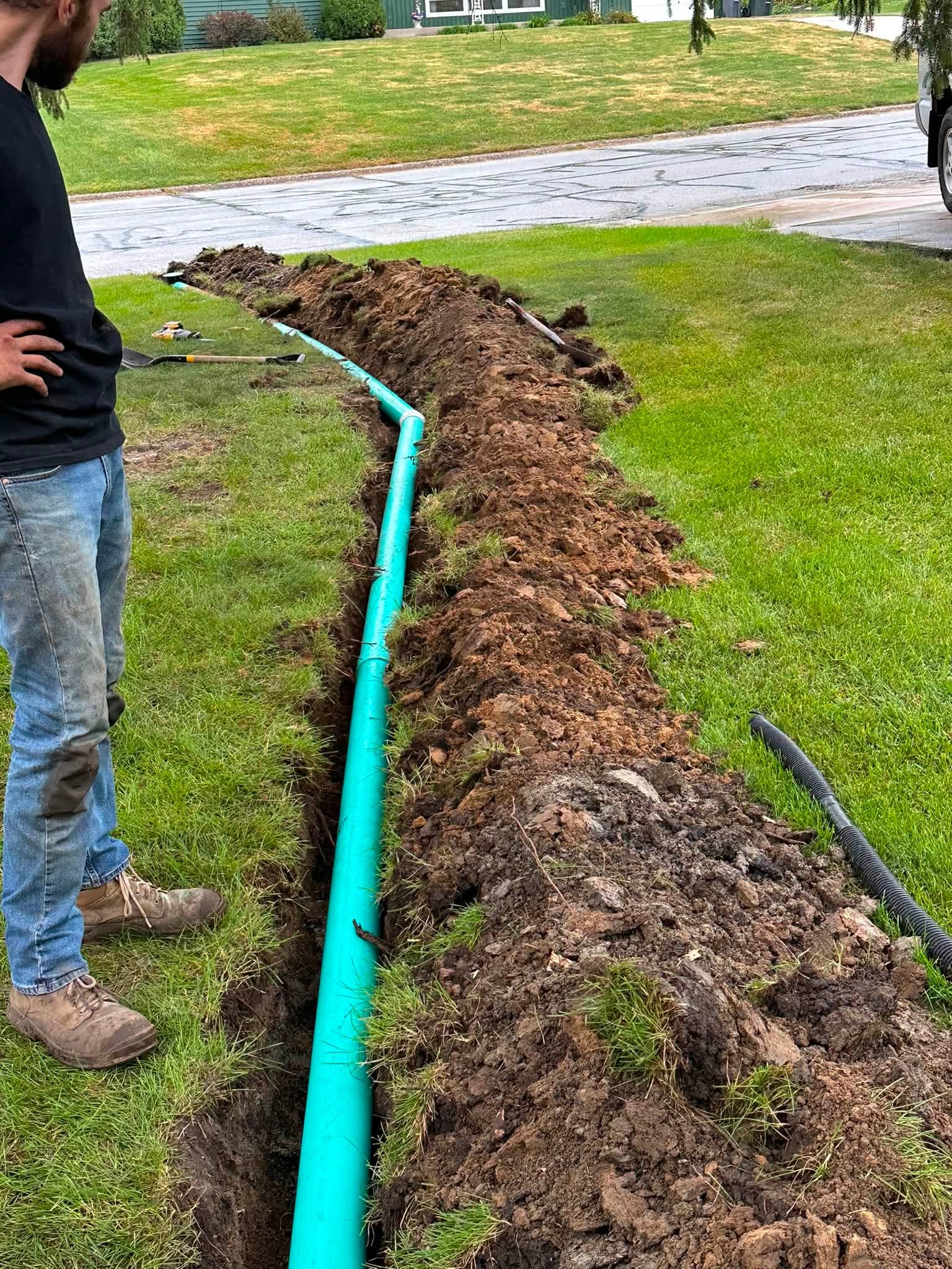 New plastic downspout line buried by A1 Sewer Service