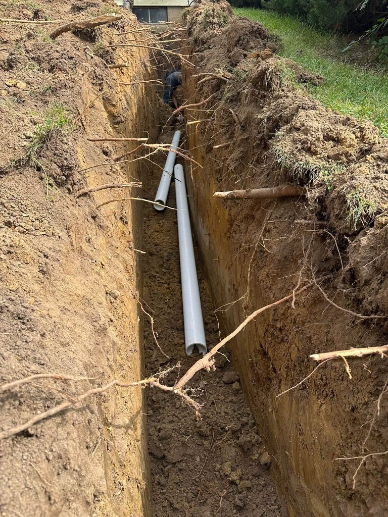 New sewer pipe laid in the trench