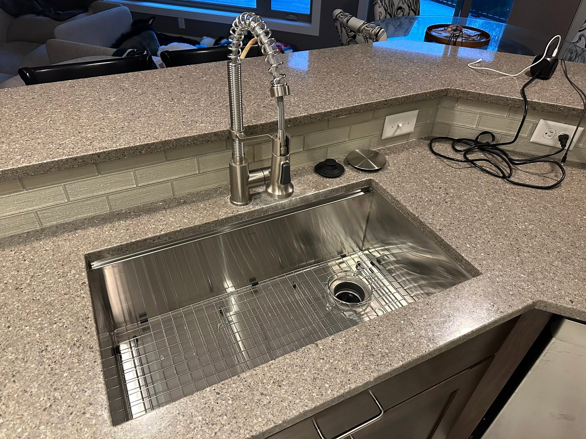 New stainless steel kitchen sink and faucet installed by A1 Sewer Service