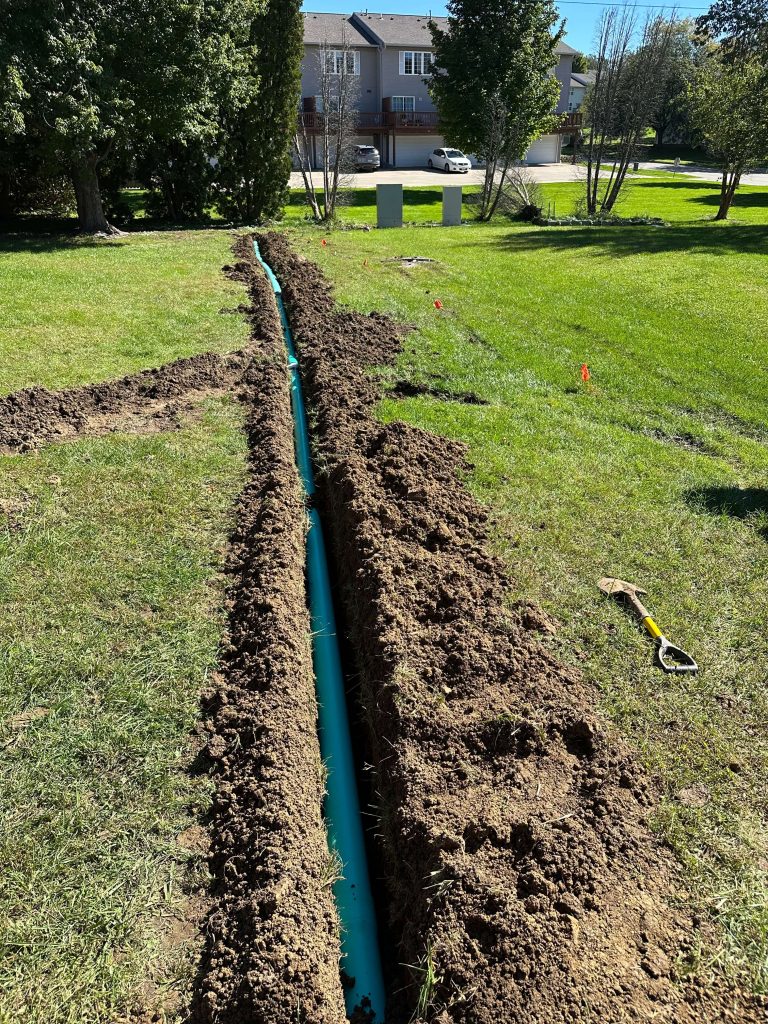 Apartment downspout drain line