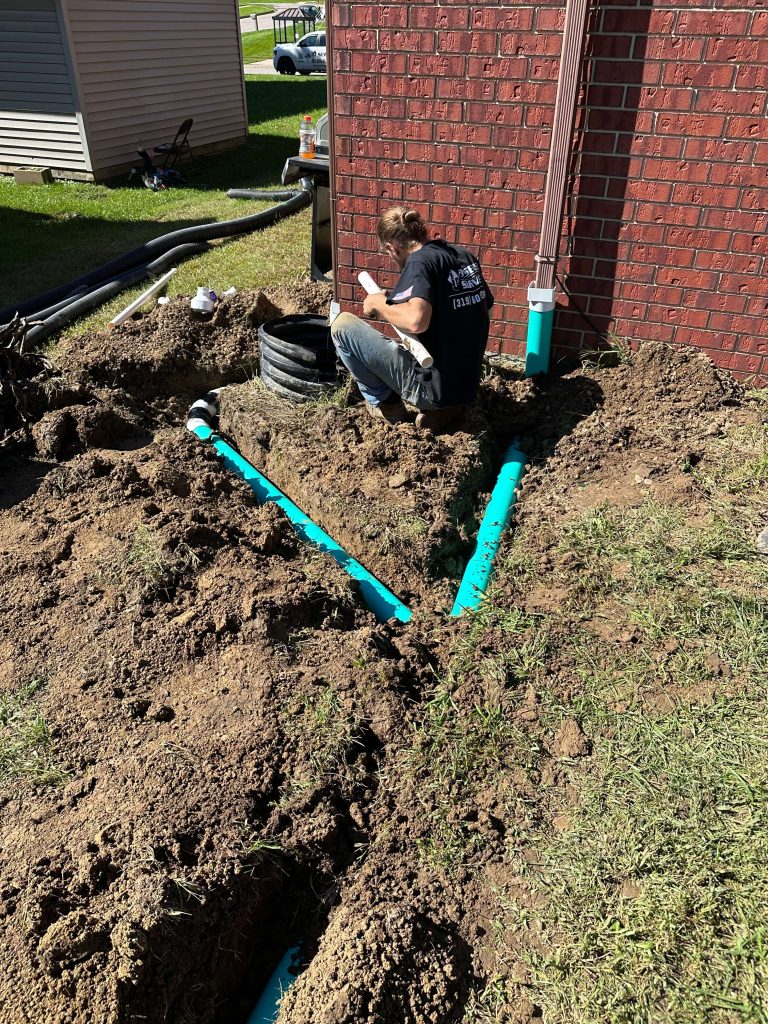 Finished downspout drain line at an apartment building